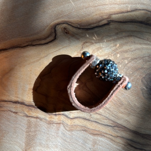 Leather ring w/ball of dark gray center crystals on a sterling silver pin. - Picture 4 of 5
